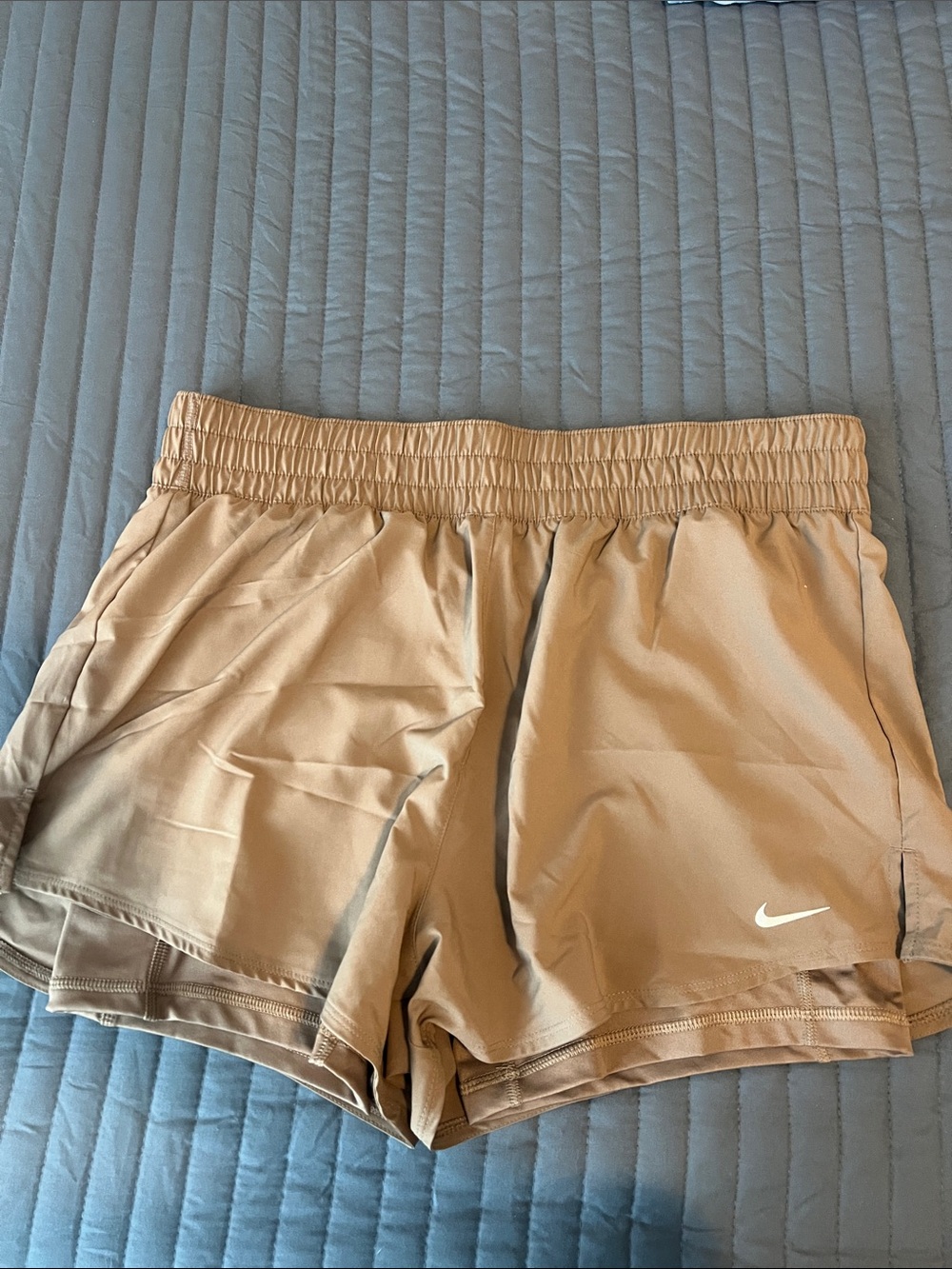 Nike Women’s Tan Athletic Running Shorts with White Swoosh